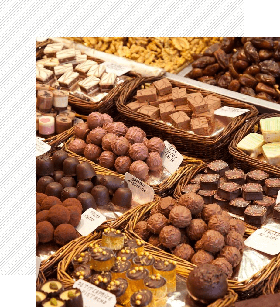 A display of various chocolates in baskets.